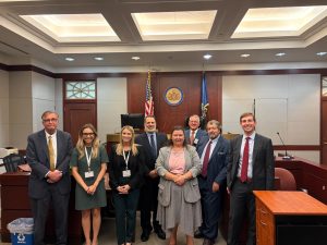 Group photo of participants and faculty from the 2025 Primerus Trial Skills Academy, including attorney Rachelle Miller of Cardelli Lanfear, standing in a courtroom at Mercer Law School.